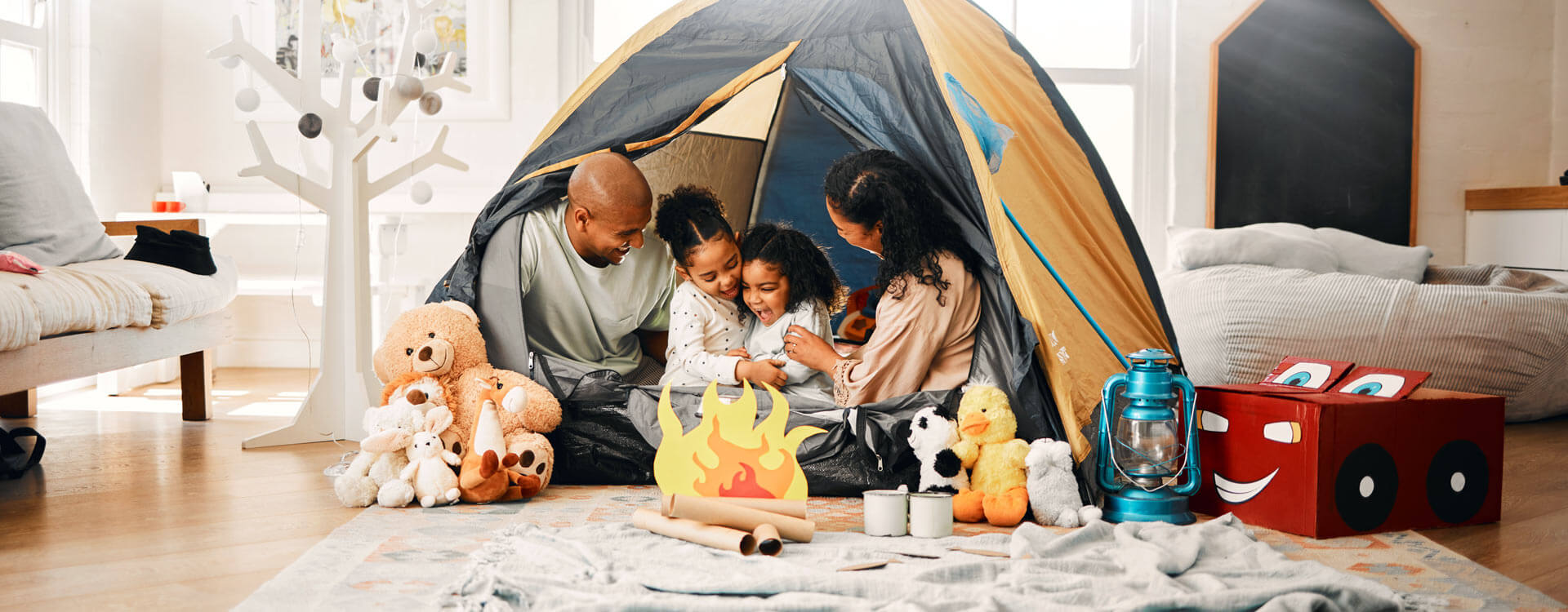 Family camping in their living room